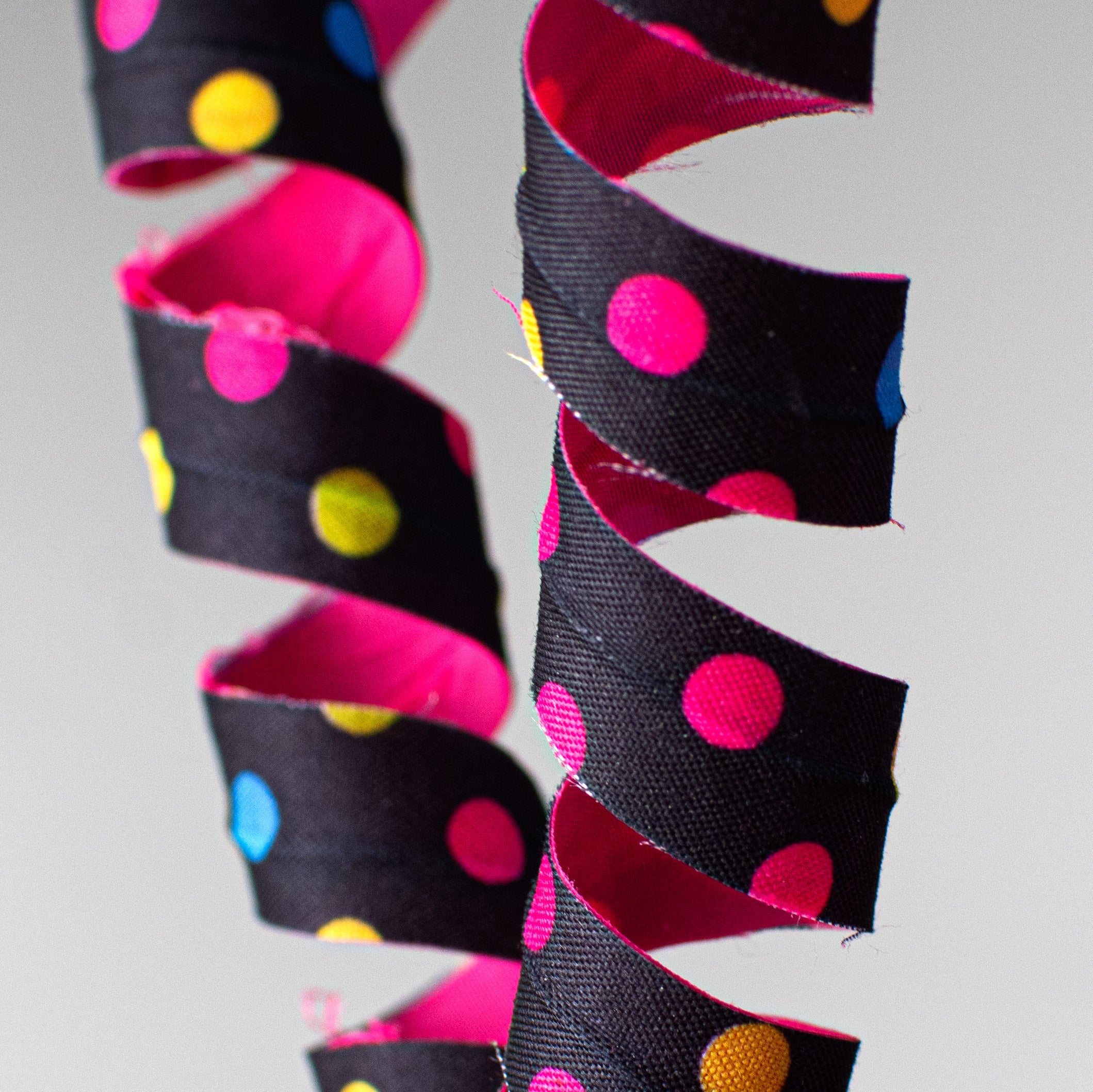 16" Polka Dot Curly Pick: Fuchsia & Black Lifestyle Photo