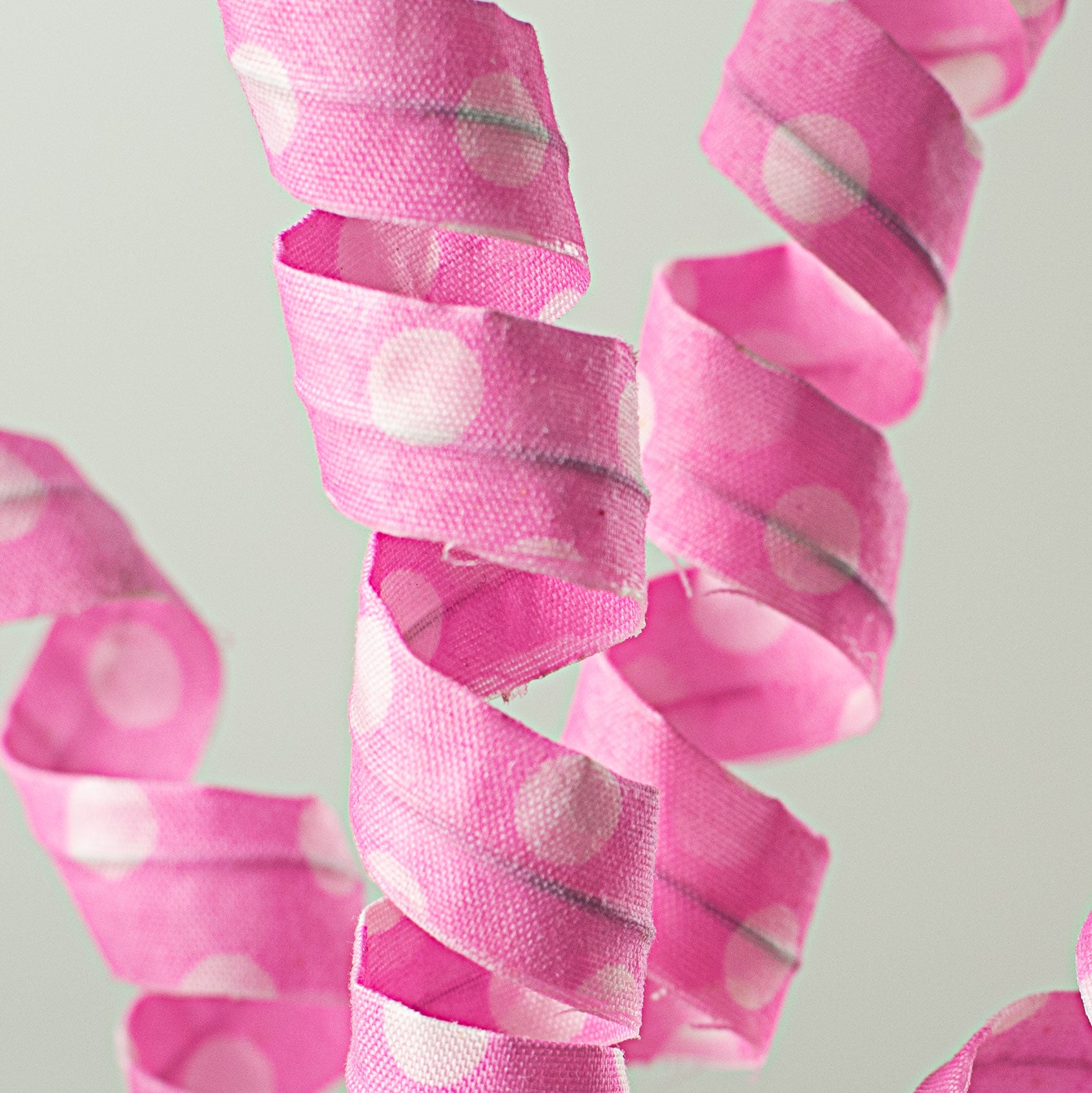 16" Polka Dot Curly Pick: Pink & White Lifestyle Photo