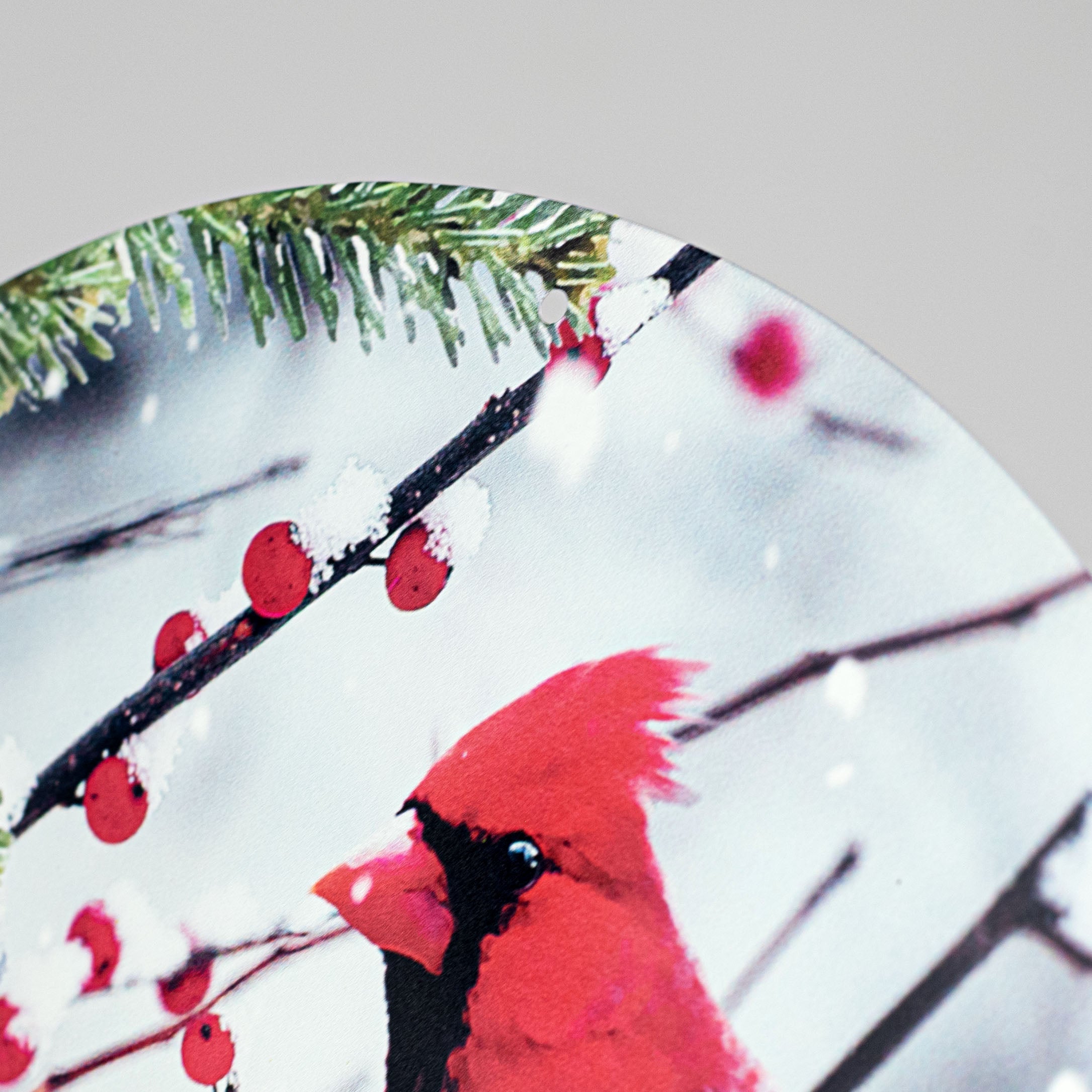 12" Round Metal Sign: Cardinals on Snowy Branch detail photo 3