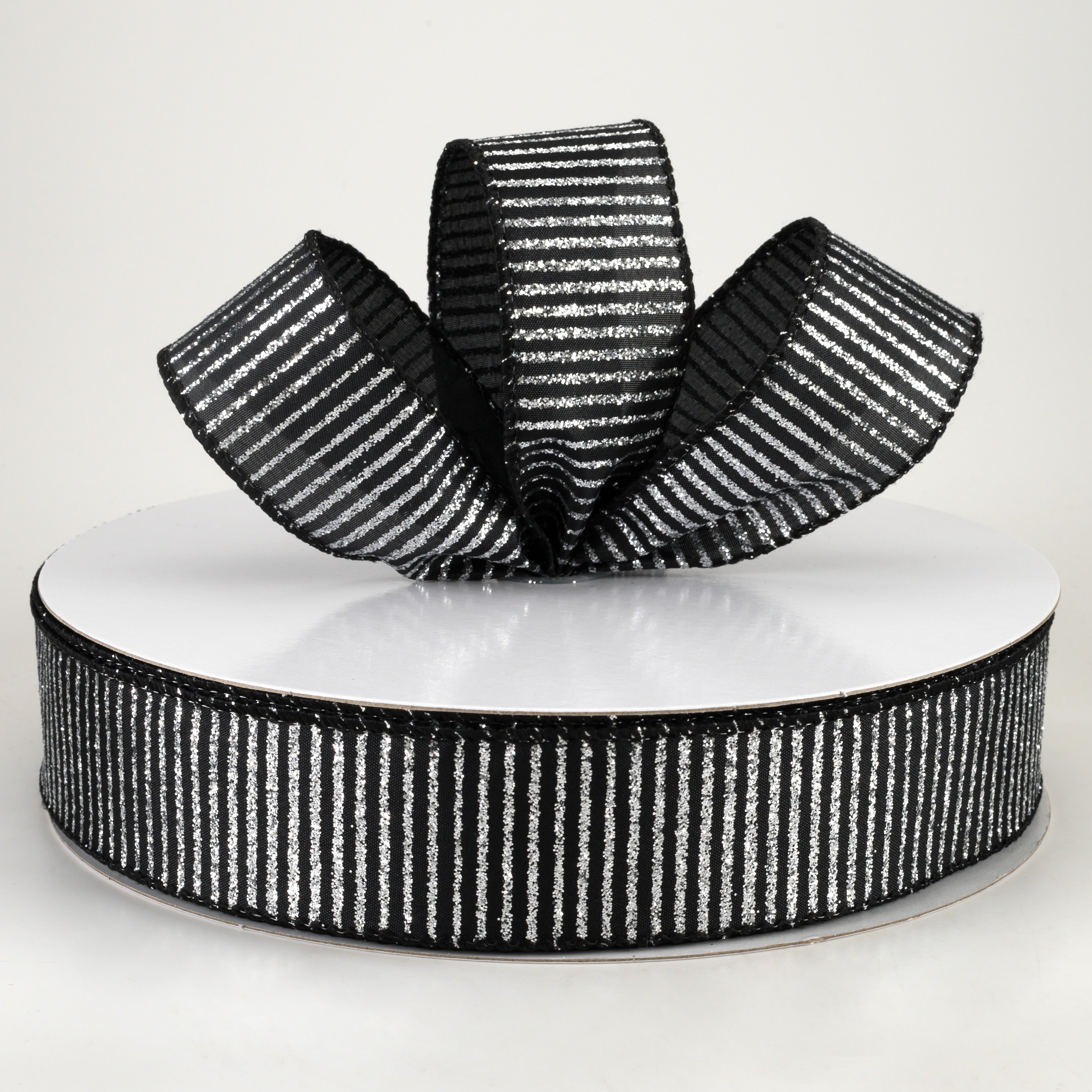 1.5" Satin Horizontal Glitter Stripe Ribbon: Silver on Black (50 Yards) Lifestyle Photo