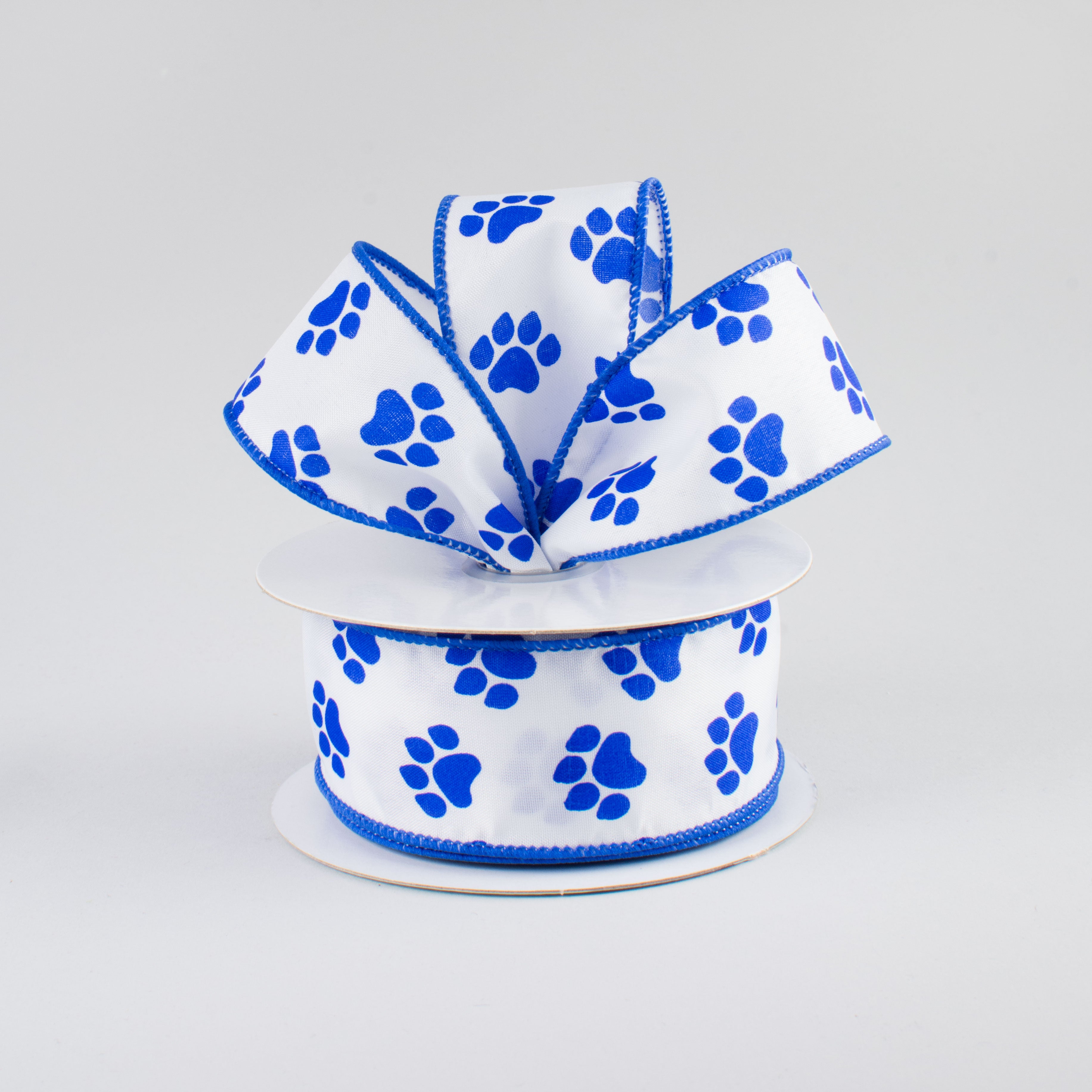 1.5" Satin Paw Print Ribbon: Blue & White (10 Yards) Lifestyle Photo