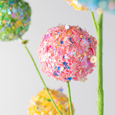 29" Sequin Glitter Ball Spray: Iridescent Pink, Yellow, Green Lifestyle Photo