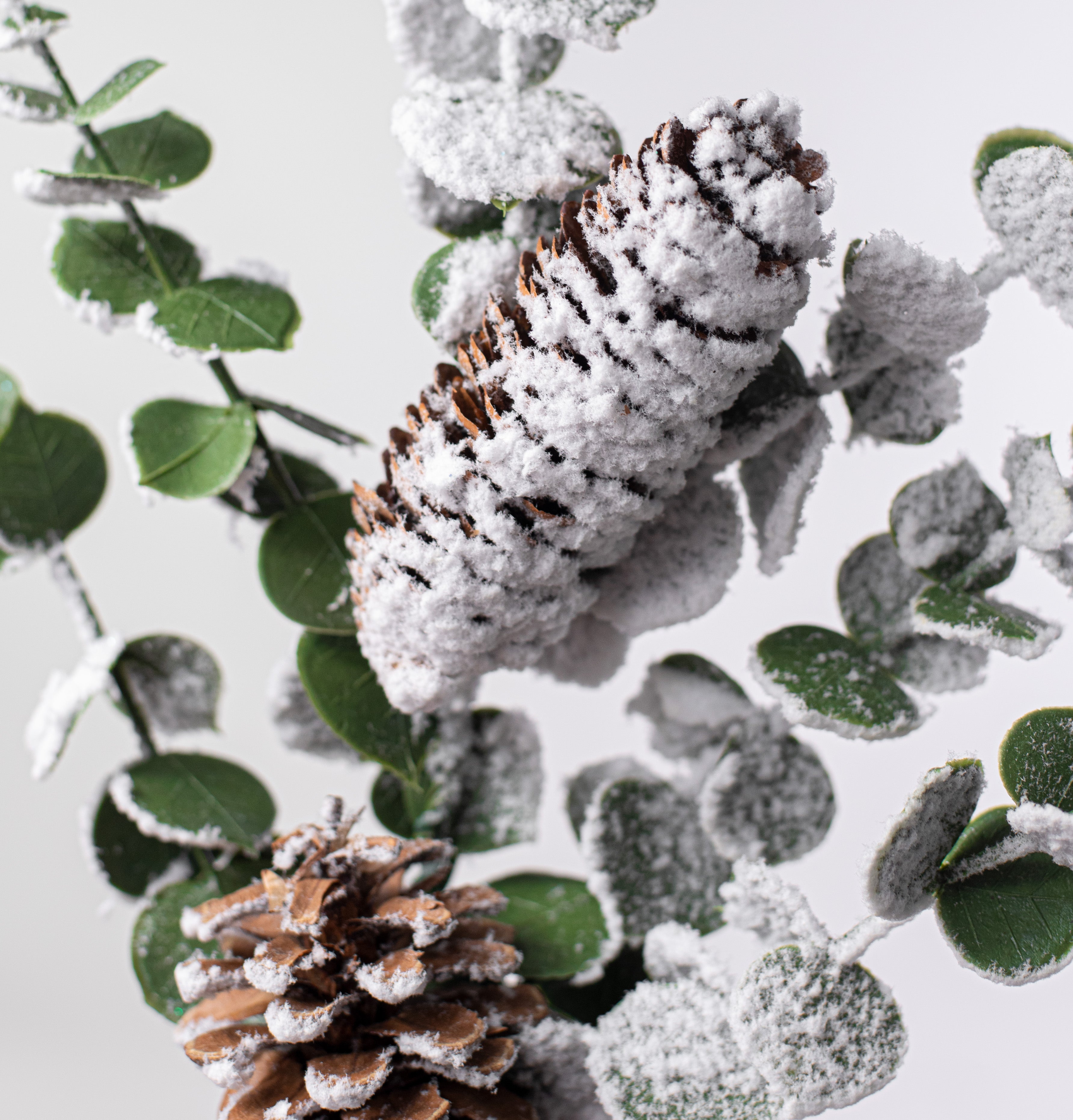18" Snow Eucalyptus Pinecone Spray Lifestyle Photo