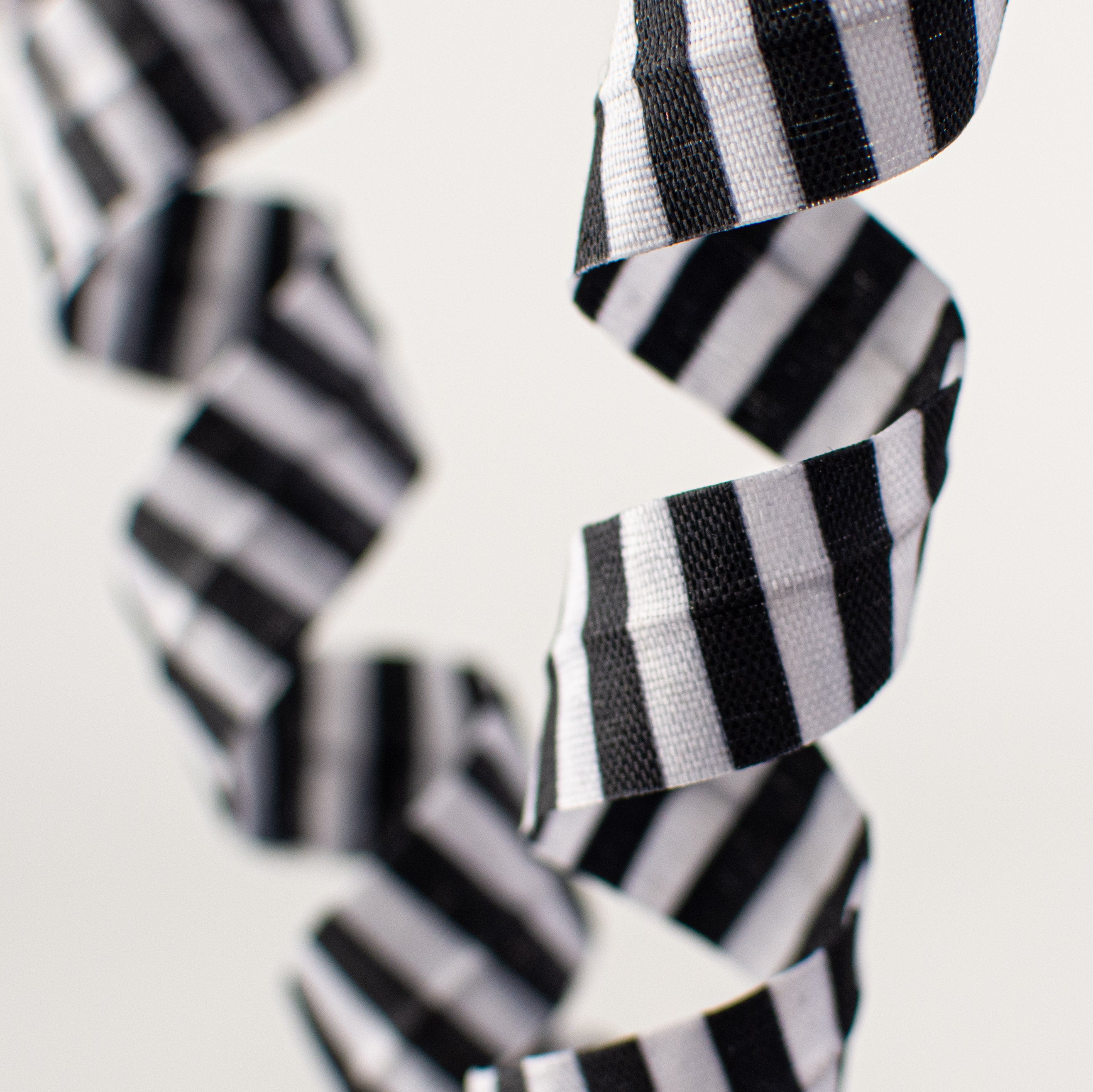 16" Stripe Curly Pick: Black & White Lifestyle Photo