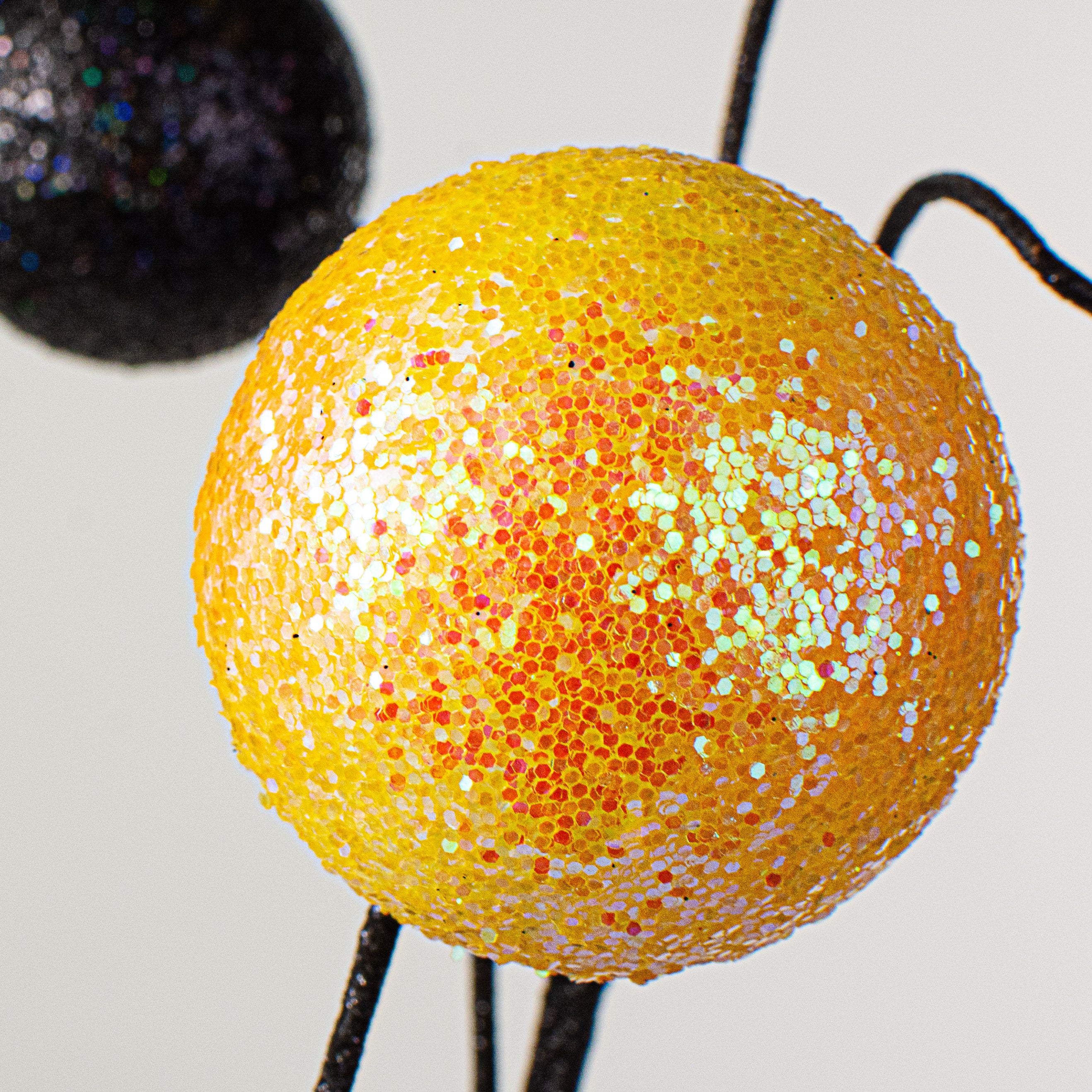 20" Stripe & Solid Glitter Ball Pick: Black & Yellow Lifestyle Photo