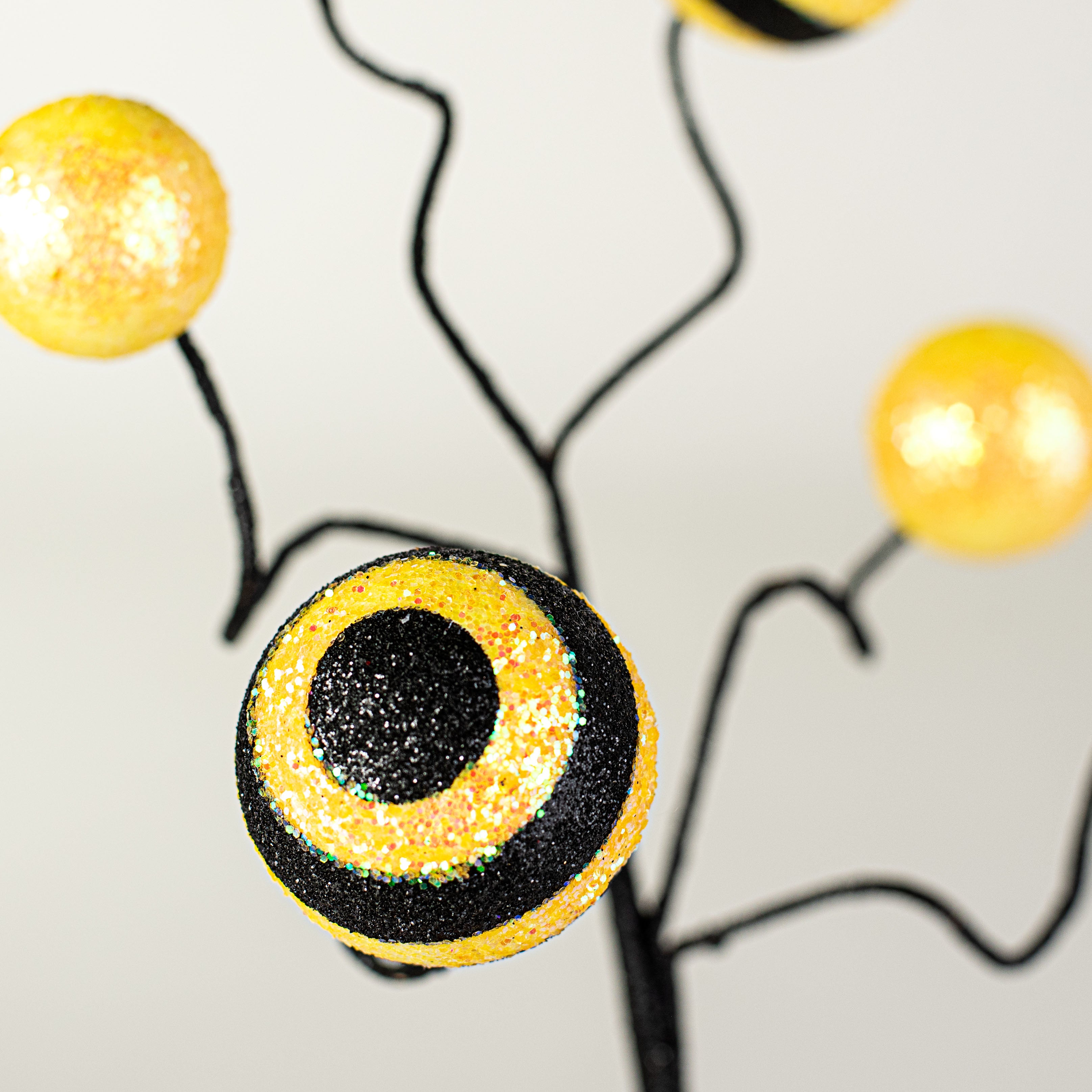 17" Stripe & Solid Glitter Ball Pick: Black & Yellow Lifestyle Photo