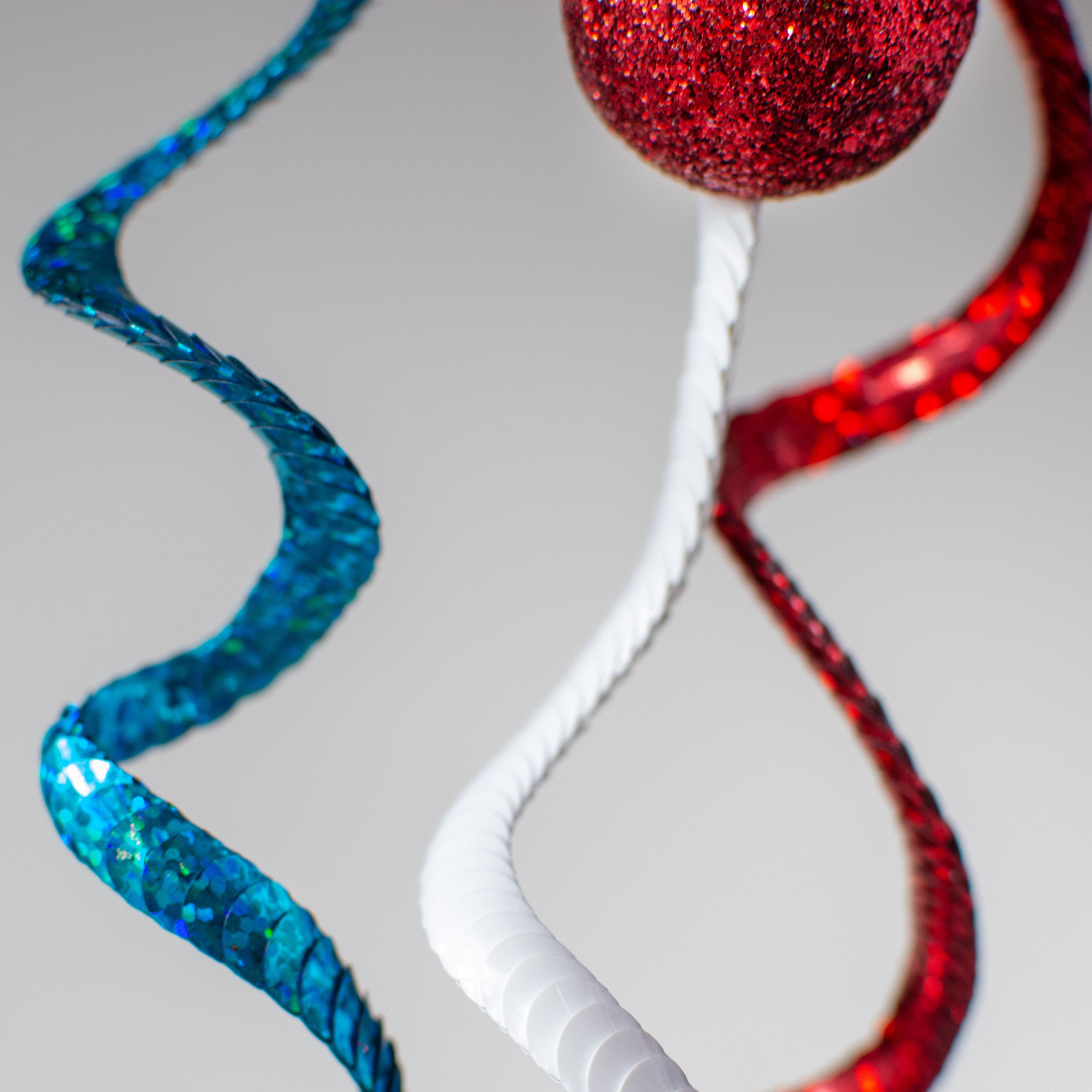 26" Swirl Sequin Glitter Ball Spray: Red & Turquoise Lifestyle Photo