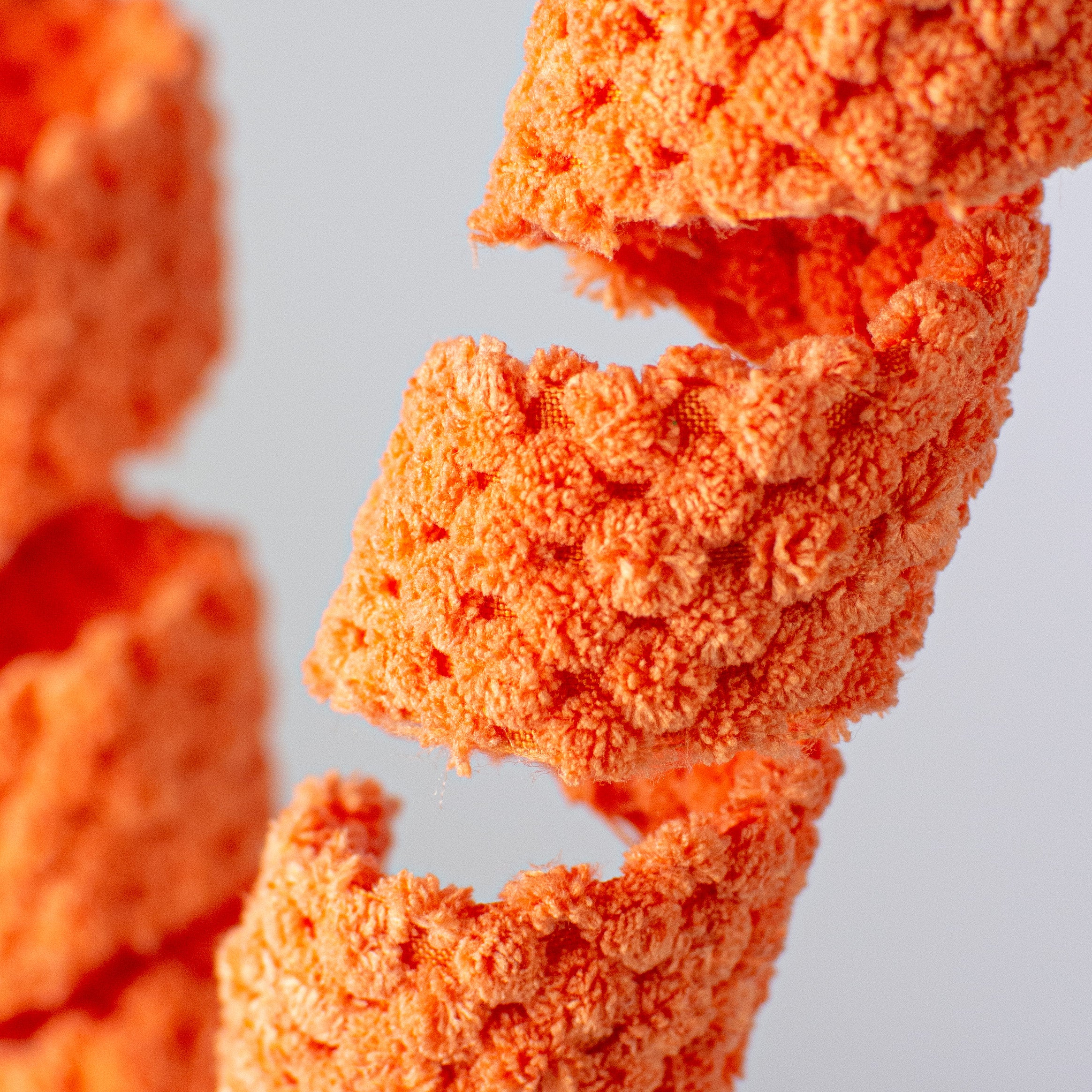 24" Terry Cloth Curly Spray: Orange Lifestyle Photo