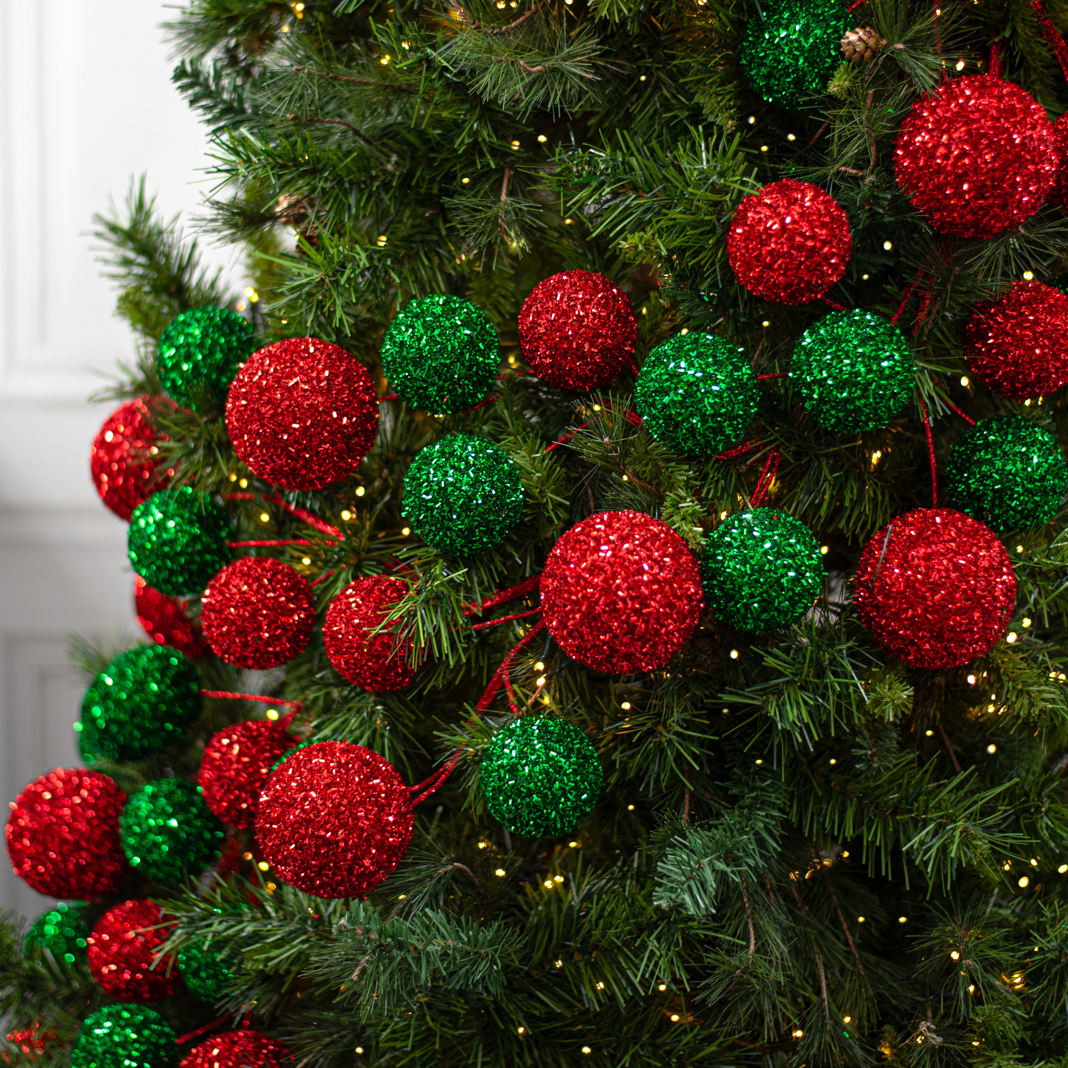 72" V-Cut Foil Jumbo Ball Garland: Red & Emerald Green Lifestyle Photo