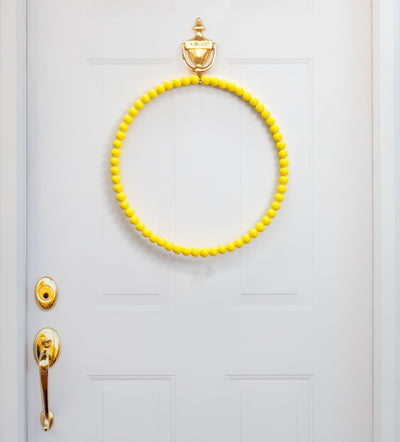 17.75" Wood Bead Wreath: Bright Yellow Lifestyle Photo