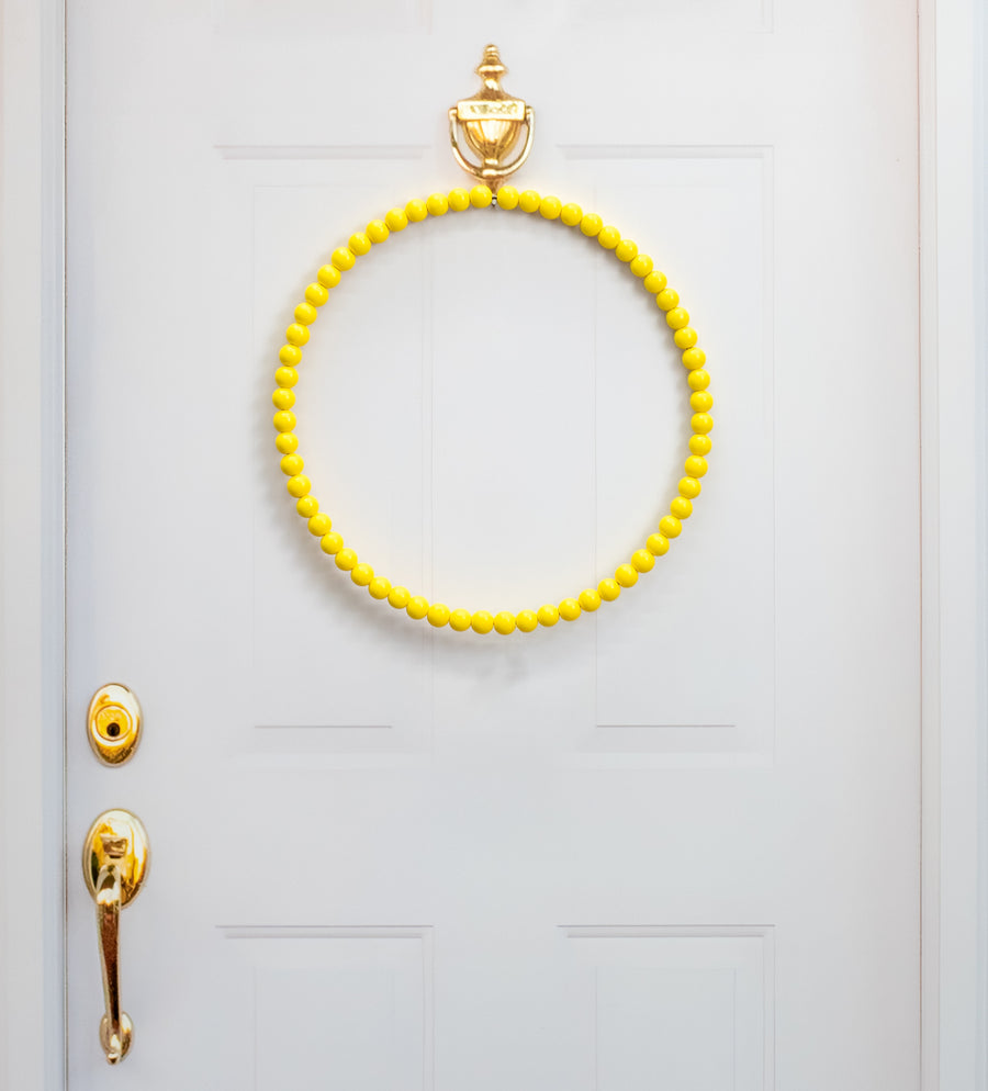 17.75" Wood Bead Wreath: Bright Yellow Lifestyle Photo