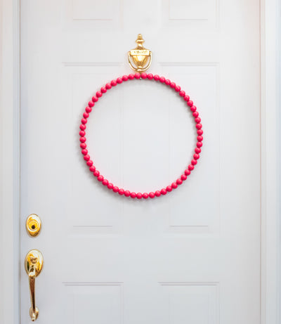 17.75" Wood Bead Wreath: Hot Pink Lifestyle Photo