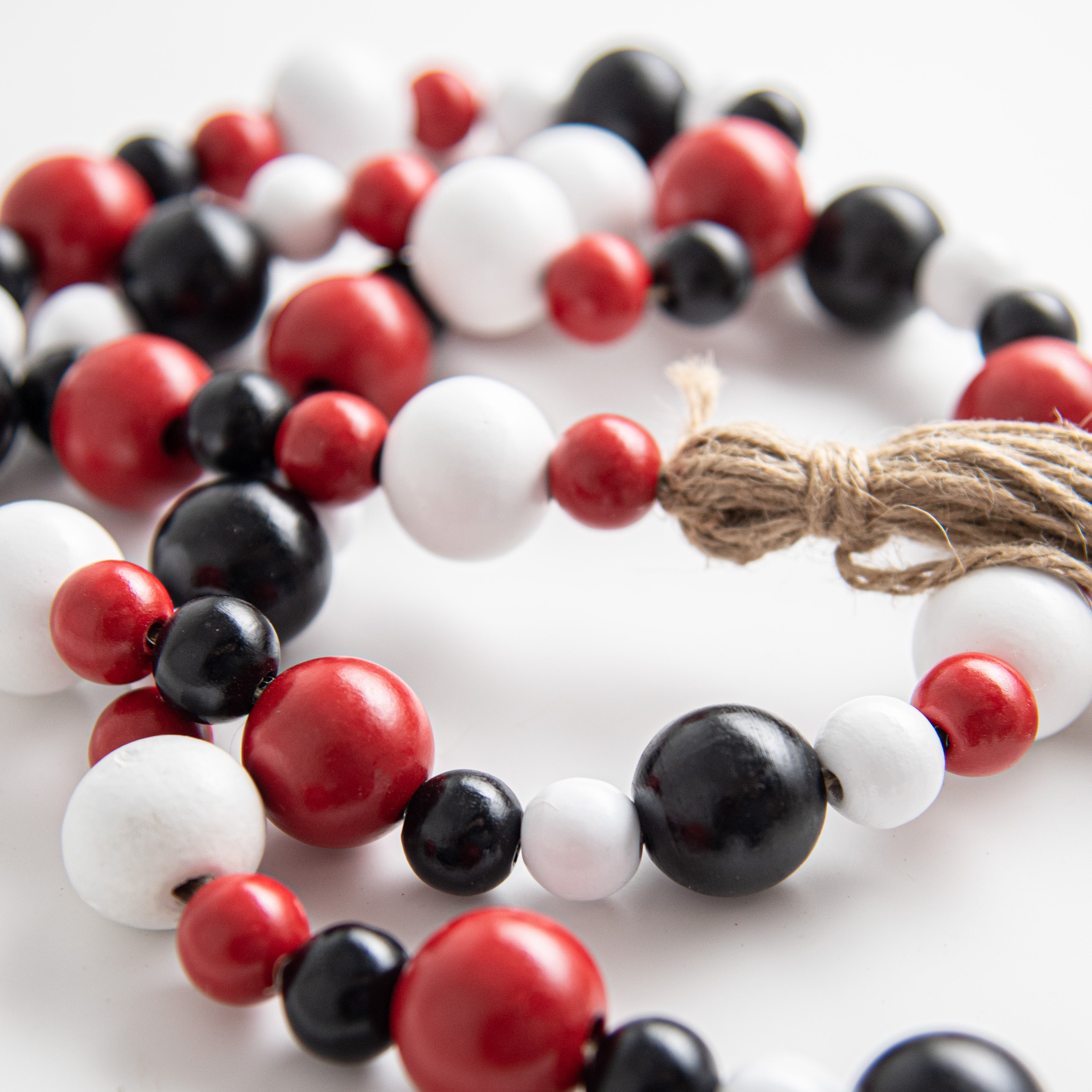 4' Wooden Bead Garland: Red, Black, White detail photo 3