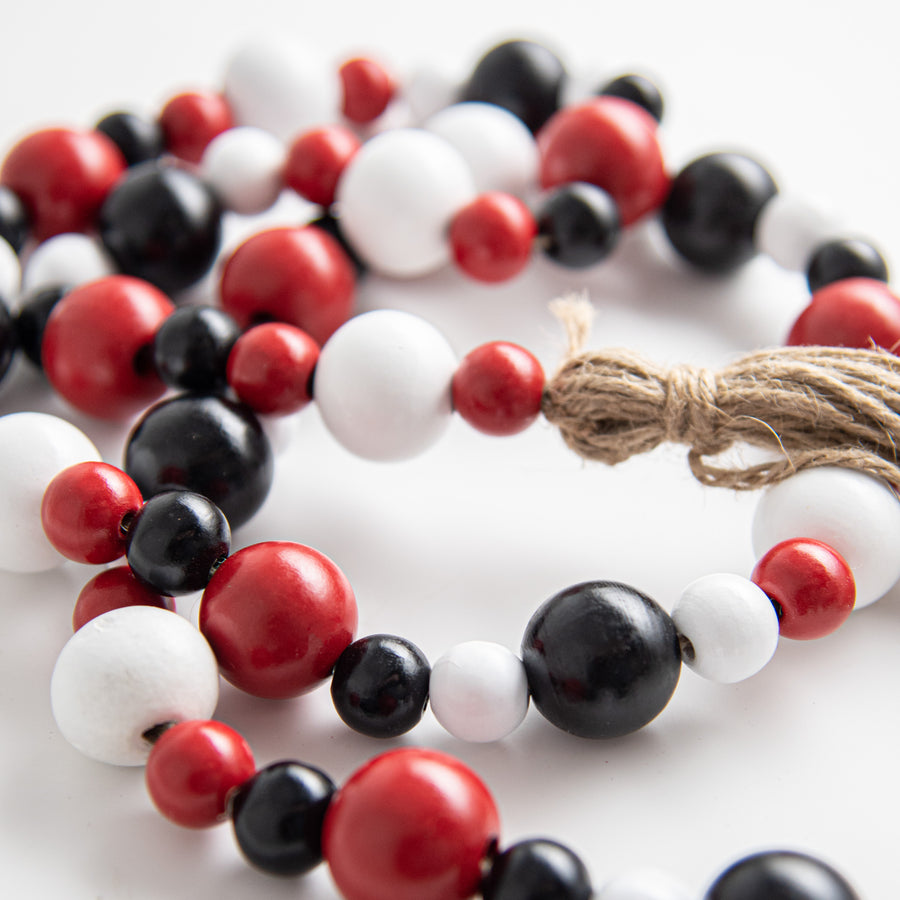 4' Wooden Bead Garland: Red, Black, White detail photo 3
