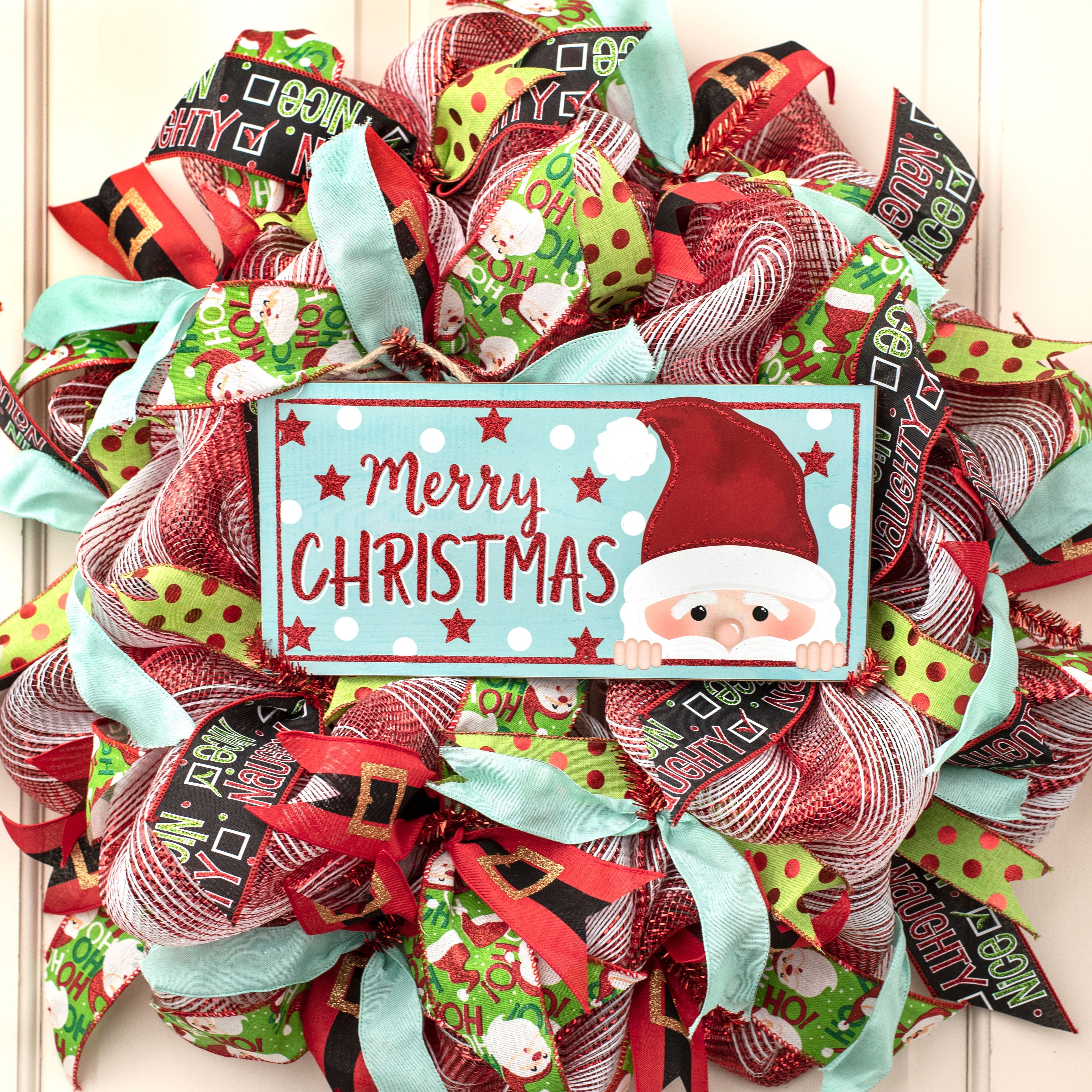 12" Wooden Sign: Christmas Glitter Peeking Santa, Ice Blue Lifestyle Photo