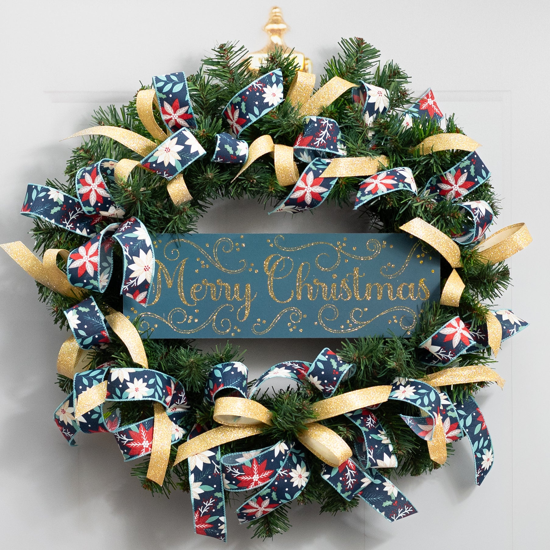 15" Wooden Sign: Merry Christmas Glitter Swirls - Teal & Gold Lifestyle Photo