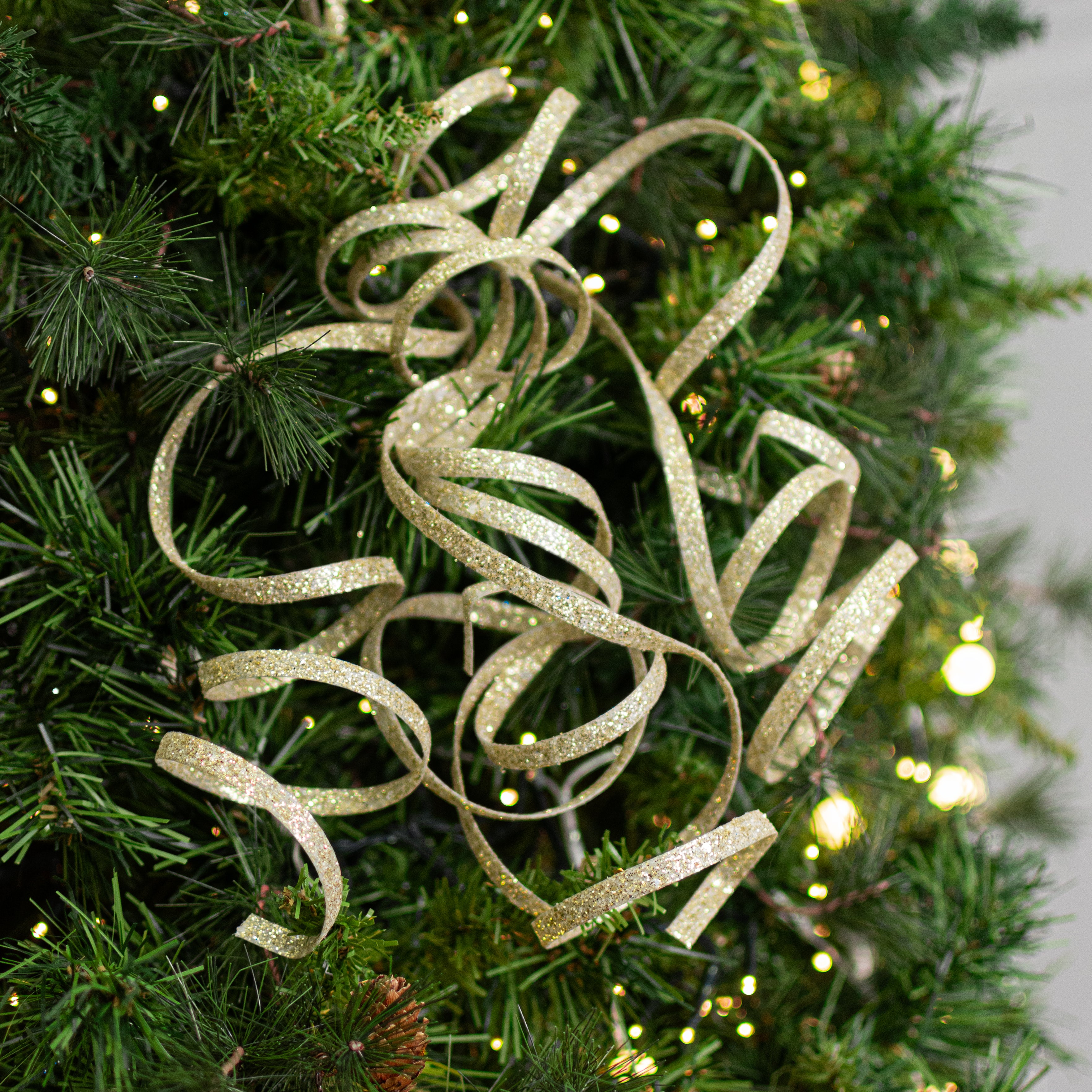 31" Curly Glitter Ribbon Spray: Champagne Gold